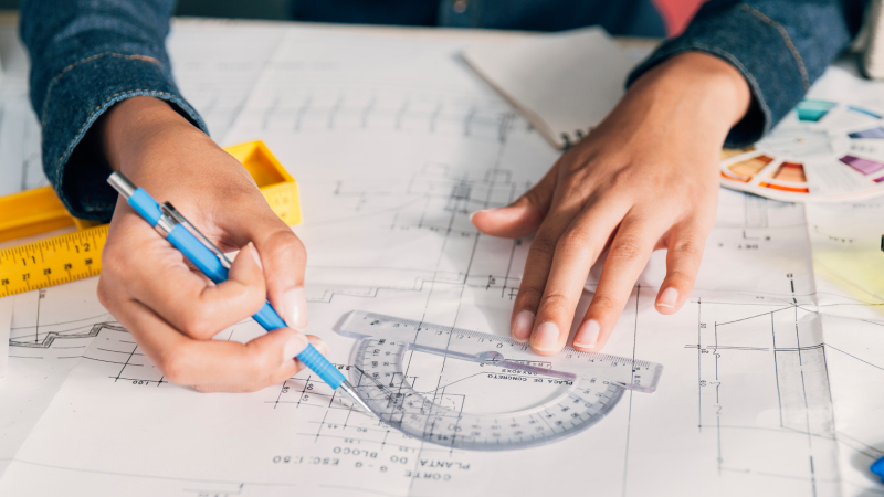 Image showing engineers discussing hydraulic system design. Our hydraulic services include expert system design to meet client specific needs and requirements.